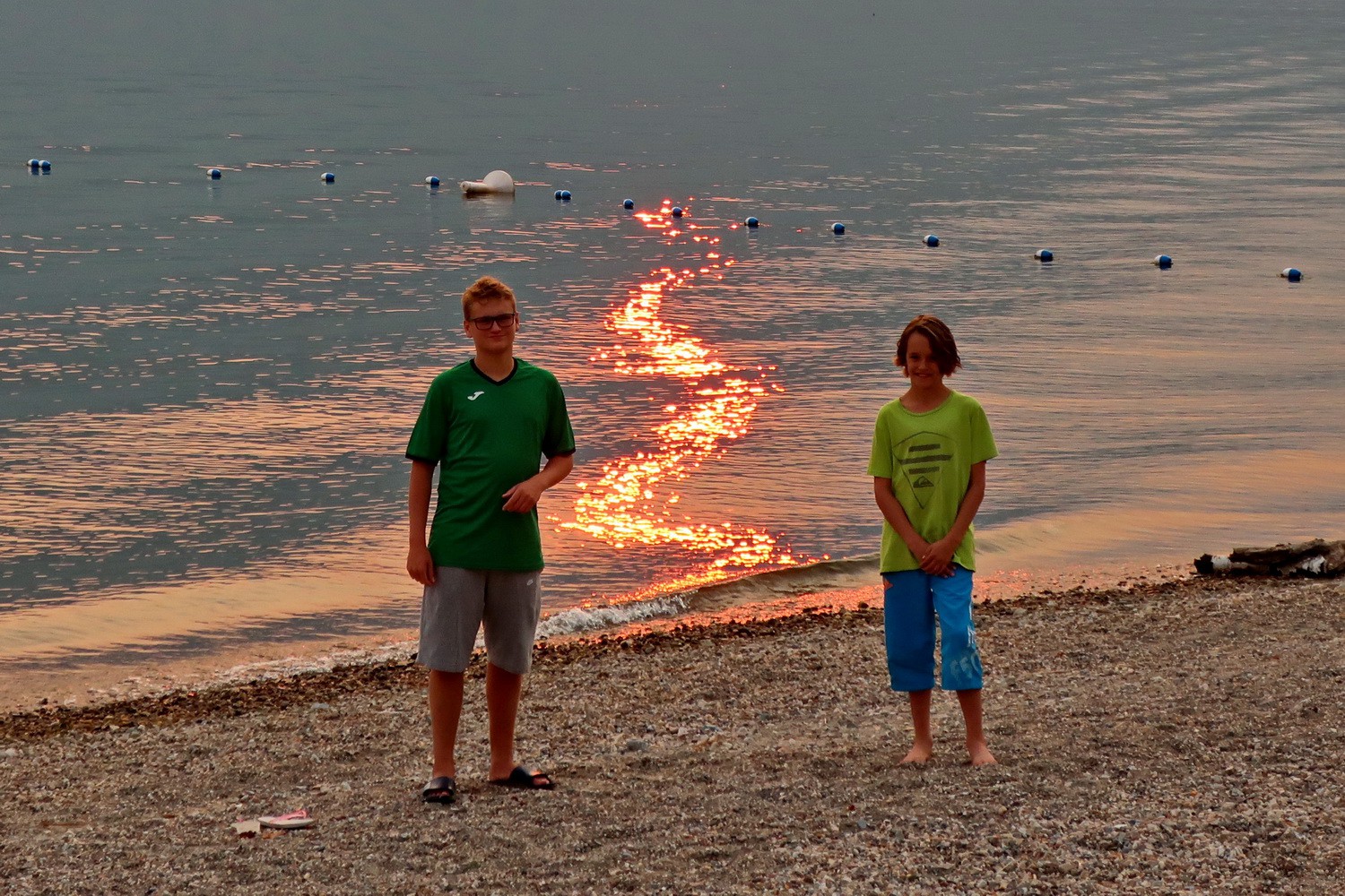 Kuba and Jay on burning Shuswap Lake at sunset